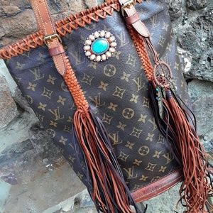 Fringed Louis Vuitton LG. Bucket
